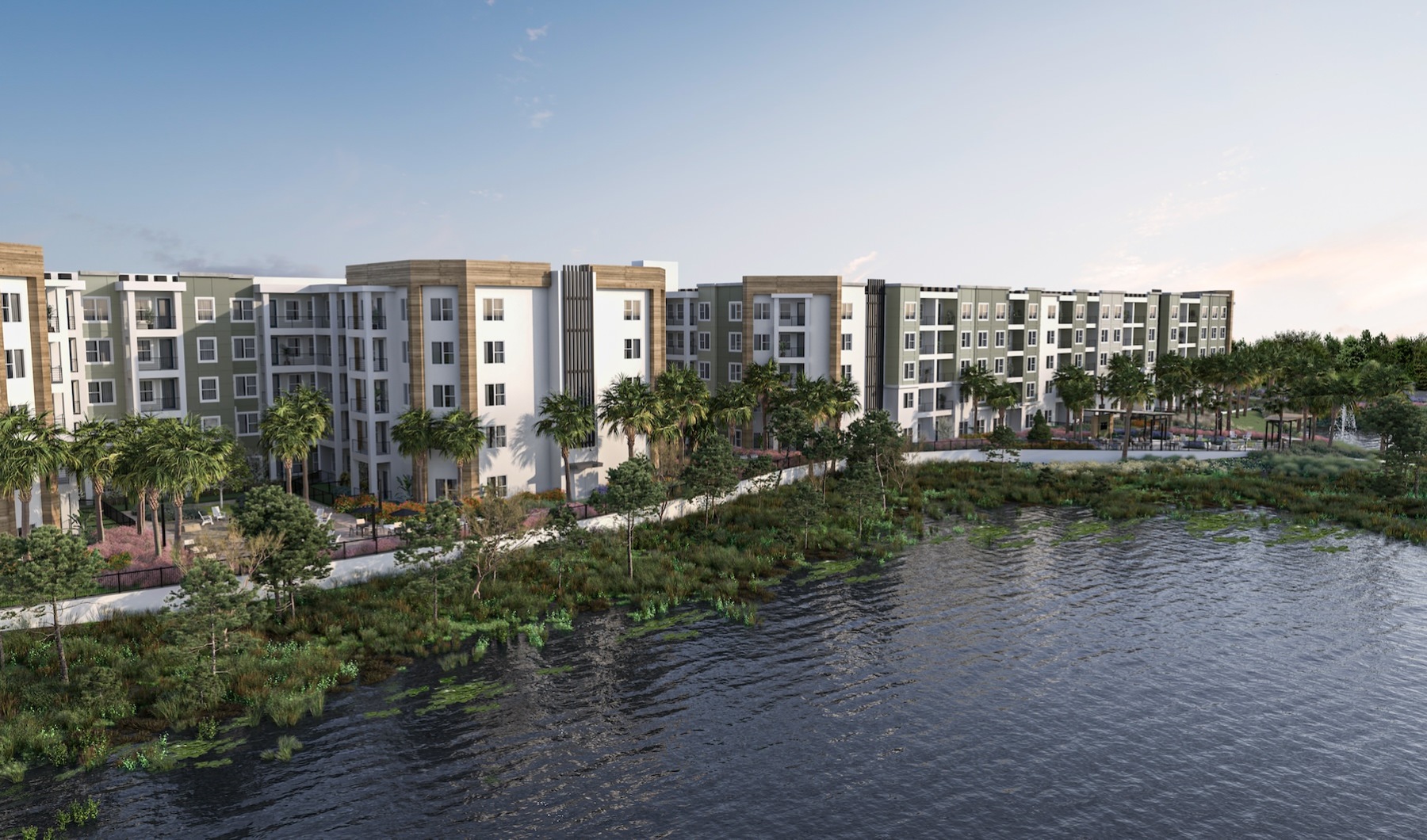 a large body of water next to a multi-level building