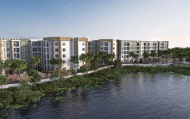 a large body of water next to a multi-level building