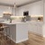 a kitchen with white cabinets
